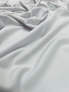 Solid matte white four way stretch nylon spandex fabric, 60'' wide.  Perfect for activewear, swimwear, form fitting dresses, tops, costumes, decoration, backdrops and so much more. Fabric is available in all colors, inquire for more colors. Form Fitting Dress, Spandex Fabric, Fabric By The Yard, All The Colors, Active Wear, Angeles, Yard, Spandex, Craft Supplies