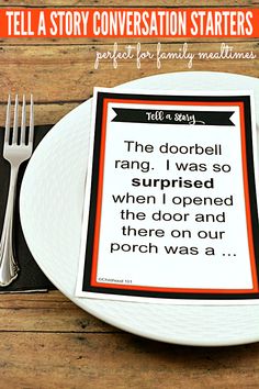 a white plate topped with a poem on top of a wooden table next to a fork and knife