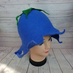 This blue wool sauna bell flower hat is made of 100% pure merino wool. Felted handcrafted hat is eco gift for bath lovers. As a sauna hat it will protect your head and hair from the heat. Hat bell flower shaped will be good acsessuary for costume party or special stress relief gift. Felted pure wool fairytale hat has a wide usage: it can be a sauna accessories, costume party elf hat, an funny hipster everyday hat, or as a festive pixie hat, or even heat keeper for teapot. Caring: washing by hand Fairy Hat, Sauna Hat, Hat Flower, Sauna Accessories, Pixie Hat, Flower Hat, Elf Hat, Eco Gifts, Flower Hats