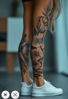 a woman's legs with flowers on them and the bottom part of her leg