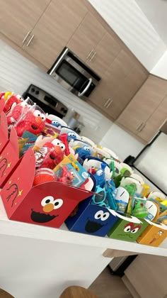 an assortment of toys on display in a kitchen