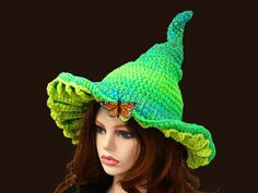 This Neon Fae Mushroom Witch Hat is ready for the Renfair, cosplay, a fun witchy fae corseted outfit for the festival, or everyday. I crocheted this in a blend of bright neon greens and blues, with yellow green gills. A slight scatter of dark yellow rhinestones grace the top, and an orange butterfly hovers at the brim. In nature, these colors usually mean you can look but don't touch! You can adjust or roll the brim to show as much of the gills as you wish, or just let them peek out here and there with a slant. Lots of fun for that fantasy mushroom fae look! This hat can fold flat for travel. -This soft witchy hat has some stretch so it will fit between 21" to 23.5" head circumference. How to measure your head: - Using a fabric tape measure or a string, place it flat against your head, and Mushroom Witch Hat, Mushroom Fae, Renfaire Costume, Mushroom Witch, Witchy Hat, Fantasy Mushroom, Cottagecore Witch, Fairy Mushroom, Ren Faire Costume