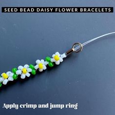 the flower bracelet is made from plastic beads and has a metal hook on it's end