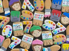 some decorated cookies are sitting on a table