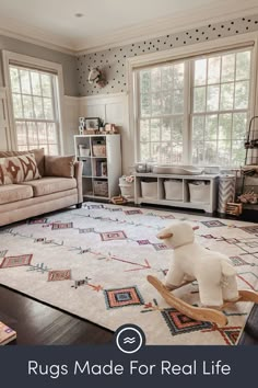 the rugs made for real life are on display in this living room