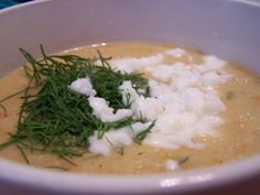 a white bowl filled with soup and garnish