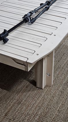 a white coffee table sitting on top of a carpeted floor