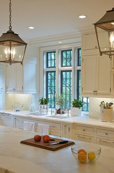 a kitchen filled with lots of white counter top space