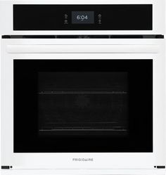 a white oven with the door open and black trim on it's front panel