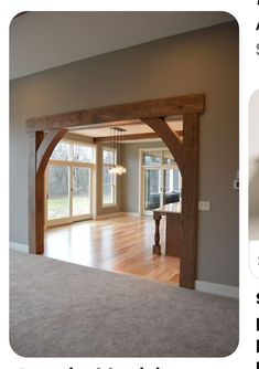 an open living room with wooden beams and windows