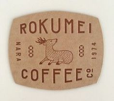 a sticker that says rokumei coffee with a deer on the side