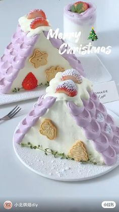 there is a cake shaped like a house with decorations on it and the words merry christmas written in chinese