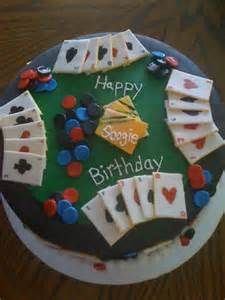 a birthday cake with playing cards on it