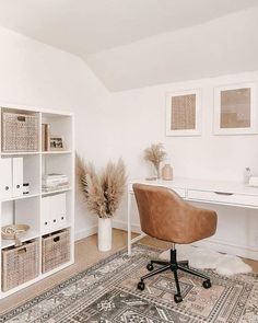 an office with a rug, desk and chair