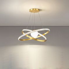 a modern chandelier hanging from the ceiling