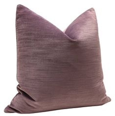 a purple pillow on a white background