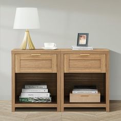 a wooden table with two drawers and a lamp on top