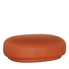 an orange ottoman sitting on top of a white floor