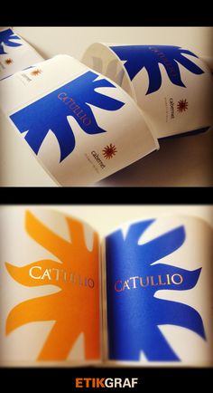 two different views of an open book with blue and orange designs