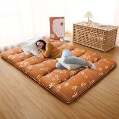 a woman laying on top of an inflatable mattress