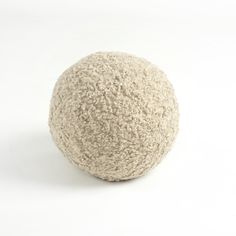 a white ball sitting on top of a table