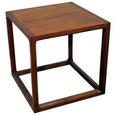 a square wooden table sitting on top of a white background