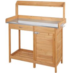 a wooden workbench with two drawers and one shelf on the side, holding a sink