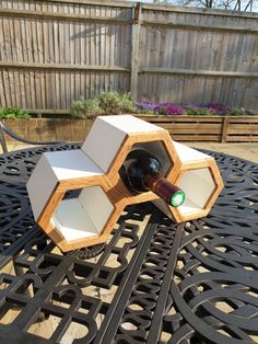 a wine bottle holder made out of wooden blocks