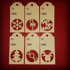 six christmas gift tags on a red background