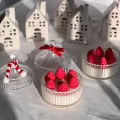 three small desserts with red and white decorations