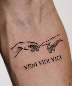 two hands touching each other with the words veni vidi vici on it