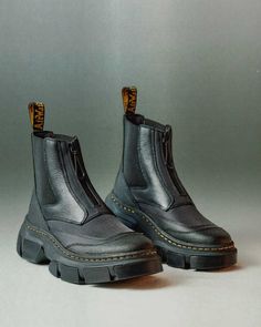 Find DR. MARTENS 2976 Dmxl Platform Chelsea Boots on Editorialist. A new era begins. The 2976 Chelsea boot reworked and reimagined. An experiment that questions the nature of our traditional silhouettes and recontextualises our industrial design history through a modernist lens. Retaining the classic slip-on elasticated gussets with the addition of a front facing water-resistant AquaGuard zip enclosure. The Chelsea boot form has been distorted with contrasting material panels to create textural 2976 Chelsea Boots, Dr Martens 2976, Platform Shoes Sandals, Lightweight Boots, Platform Chelsea Boots, Patent Boots, Botas Chelsea, Yellow Heels, Accessories Bags Shoes