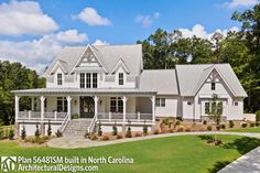 this is an image of a house in north carolina with white trim and gray shingles