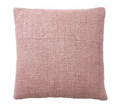 a pink pillow with a textured pattern on the front and back, sitting on a white background