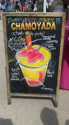 a chalkboard sign with an ice cream sundae and information about the different flavors