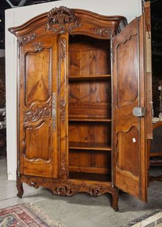 an old wooden armoire with carvings on it