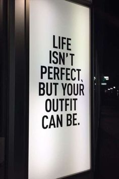 a sign that says life isn't perfect but your outfit can be