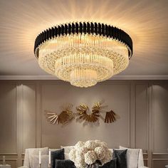 an elegant living room with chandelier and couches