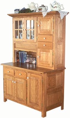 a wooden china cabinet with glass doors and drawers on it's sides, in front of a white background