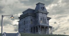 an old house with a clock on the top of it's steeple and a street light in front of it