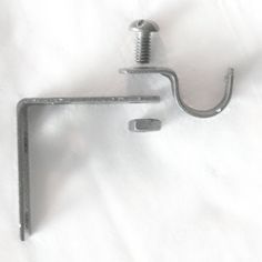 an image of a metal hook on a white sheet