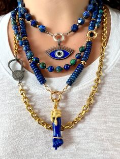 This handmade, one-of-a-kind beaded gemstone necklace features gorgeous faceted malachite, azurite and chrysocolla beads, which occur together in nature. The beautiful blue-green beads are spaced here with pyrite beads, and finished with an 18k gold-plated sailor clasp, which also doubles as a charm holder (charms sold separately). Together, malachite, azurite and chrysocolla work synergistically to provide the wearer with deep healing, protection and clear communication. Pyrite is a very grounding stone and offers an additional layer of protection to those who wear it.    --- CARE INSTRUCTIONS All of Rocks and Stars' pieces are delicate and require proper care.  Please follow the guidelines below to preserve your piece: * Do not expose the jewelry to water.  Remove before showering and sw Luxury Turquoise Amulet Necklace With Natural Stones, Artisan Jewelry With Natural Malachite Stones, Artisan Malachite Jewelry With Natural Stones, Spiritual Beaded Malachite Jewelry, Spiritual Malachite Beaded Jewelry, Turquoise Malachite Beaded Jewelry, Artisan Pendant Jewelry With Faceted Beads, Artisan Malachite Gemstone Jewelry, Malachite Gemstone Necklaces With Round Beads