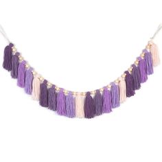 a purple and white tasselled necklace