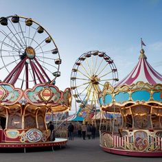 two colorful carnival rides sitting next to each other