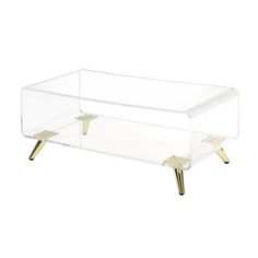 an acrylic coffee table with gold legs and a clear plastic tray on top