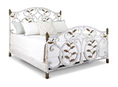 a bed with white sheets and pillows on it's headboard, in front of a white background