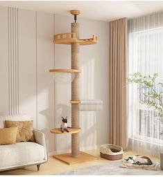 a cat tree in the middle of a living room