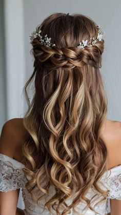 a woman with long blonde hair wearing a wedding dress and a flowered headpiece