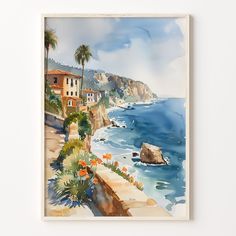 a watercolor painting of a beach with houses and palm trees on the cliff side