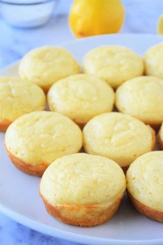 several lemon muffins on a white plate